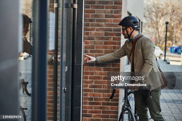 businessman ringing a door bell - man ringing door bell stock pictures, royalty-free photos & images