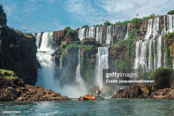 iguacu waterfalls at the border of argentina and brasil - iguazu falls boat stock pictures, royalty-free photos & images