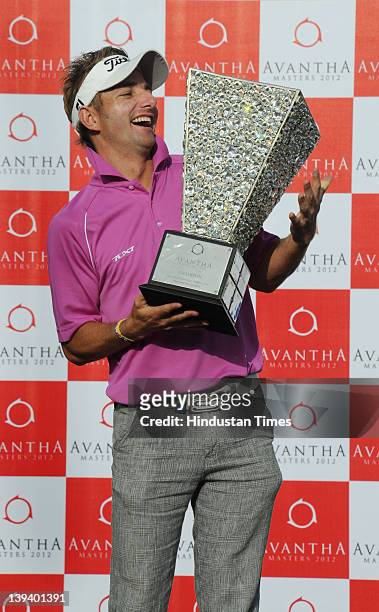 Jbe Kruger of South Africa poses with the Avantha Masters 2012 trophy at the Golf and Country club on February 19, 2012 in Gurgoan, India. The South...