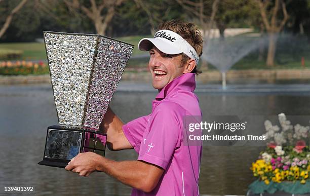 Jbe Kruger of South Africa poses with the Avantha Masters 2012 trophy at the Golf and Country club on February 19, 2012 in Gurgoan, India. The South...