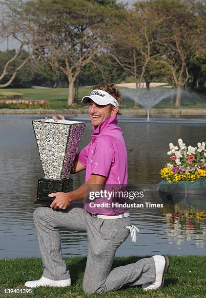 Jbe Kruger of South Africa poses with the Avantha Masters 2012 trophy at the Golf and Country club on February 19, 2012 in Gurgoan, India. The South...