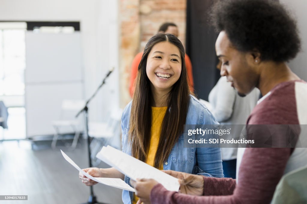 During tryouts for play, two actors practice lines together
