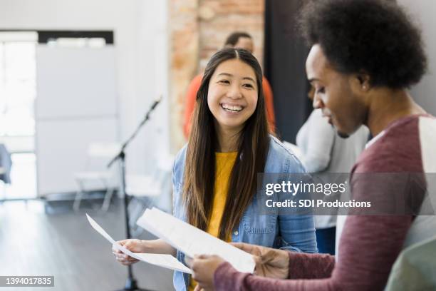 during tryouts for play, two actors practice lines together - actress rehearsing stock pictures, royalty-free photos & images