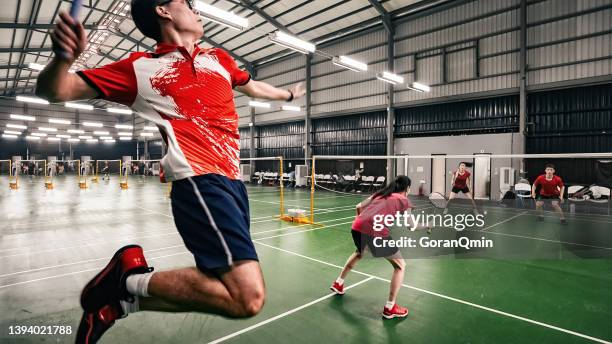 《badminton spirit》jump smash during the match - badminton smash stock pictures, royalty-free photos & images