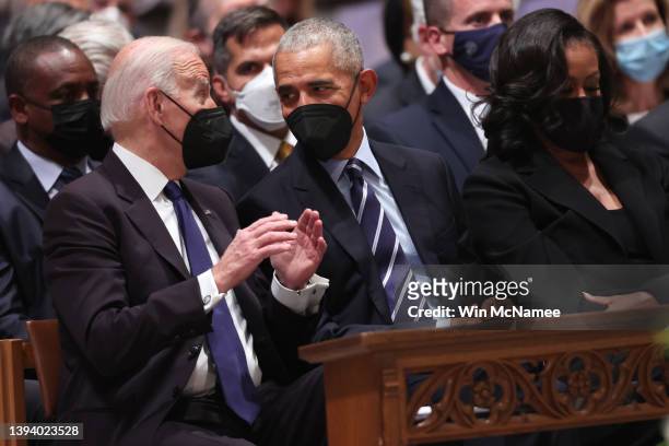 President Joe Biden talks with former U.S. President Barack Obama at the funeral service for former U.S. Secretary of State Madeleine Albright at the...