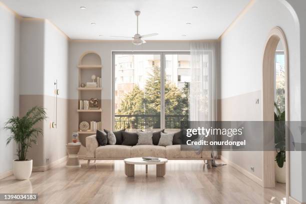 modern living room interior with sofa, coffee table, parquet floor and garden view from the window - window with view on garden stockfoto's en -beelden