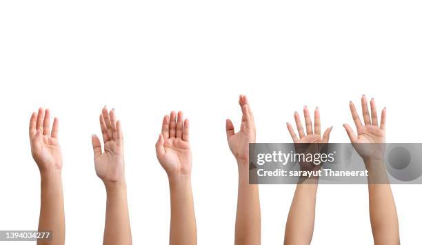 lots of people raising their hands on the white background. isolate - palma de la mano fotografías e imágenes de stock