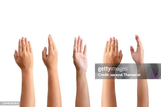 lots of people raising their hands on the white background. isolate - arms stockfoto's en -beelden