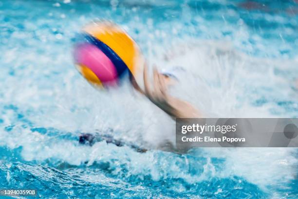 water polo ball with huge water splash, sports backgrounds - frozen and blurred motion stock pictures, royalty-free photos & images