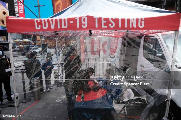 Covid-19 testing tent stands in Times Square on April 27, 2022 in New York City. Unlike other parts of Manhattan, Times Square is quickly returning...