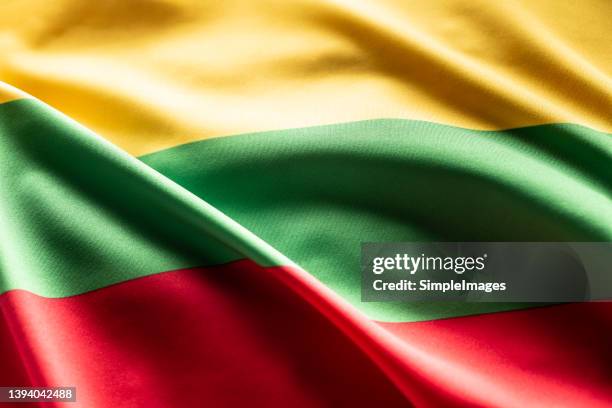 the lithuanian flag blows in the wind. - tri color stockfoto's en -beelden