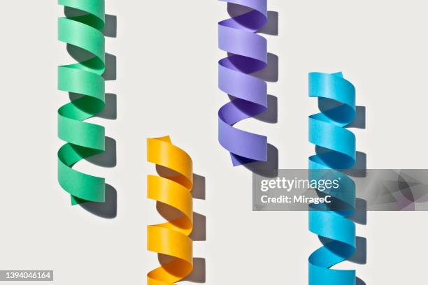 coiled paper stripes interlocked - rna stock pictures, royalty-free photos & images