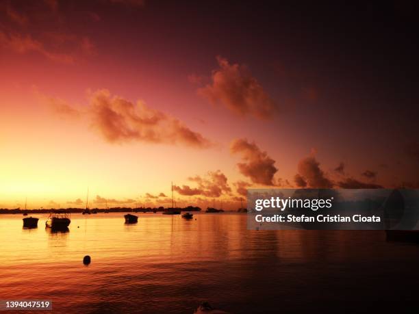 golden sunset grand baie,  mauritius - mauritius beach stock-fotos und bilder