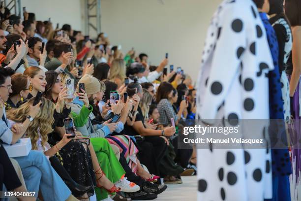 The audience take pictures during the Benito Santos show as part of the Mercedes-Benz Fashion Week Mexico 2022 - Day 2 at Sofitel Mexico City Reforma...