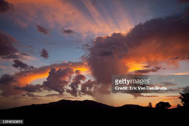 colorful clouds at sunset - eric van den brulle stock pictures, royalty-free photos & images