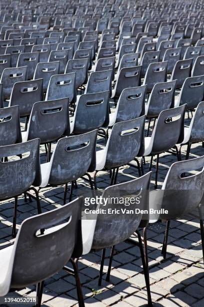 rows of chairs - eric van den brulle stock pictures, royalty-free photos & images