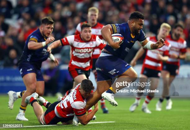 Sione Vailanu of Worcester Warriors is tackled by Freddie Thomas of Gloucester Rugby during the Premiership Rugby Cup match between Gloucester Rugby...