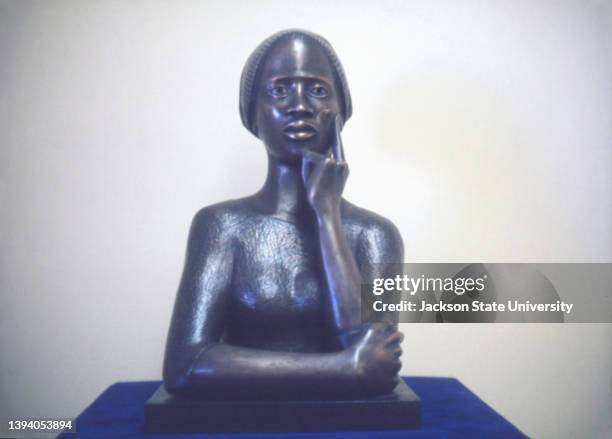 Close-up of a front view of a Waist-length bronze bust of Phillis Wheatley a mid -18th century poet, Created by Elizabeth Catlet. The bust was...