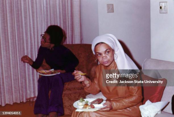 Sonia Sanchez eating food during The Phillis Wheatley Poetry Festival.