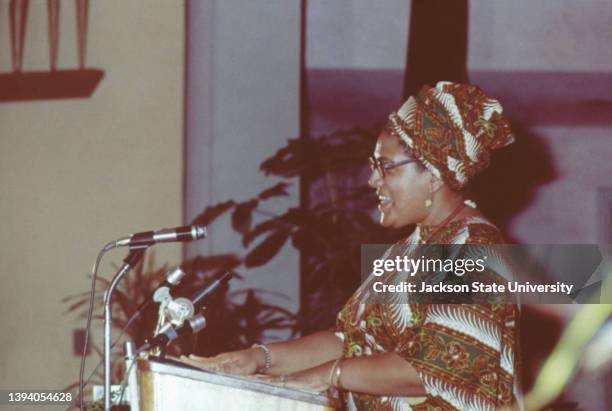 Audre Lorde talking on microphone at The Phillis Wheatley Poetry Festival.