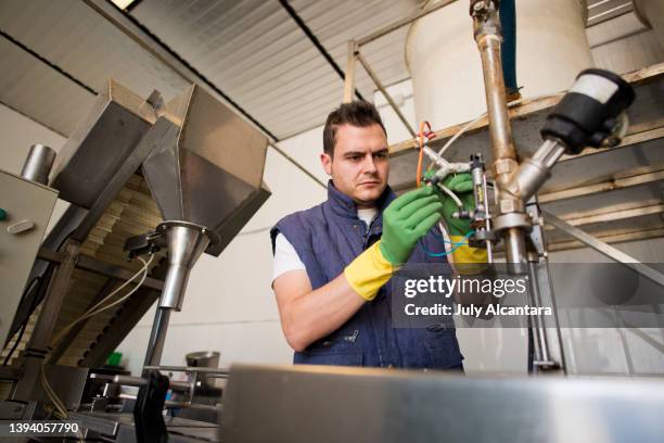 worker programming and reparing factory machine, elecrician - factory wide angle stock pictures, royalty-free photos & images