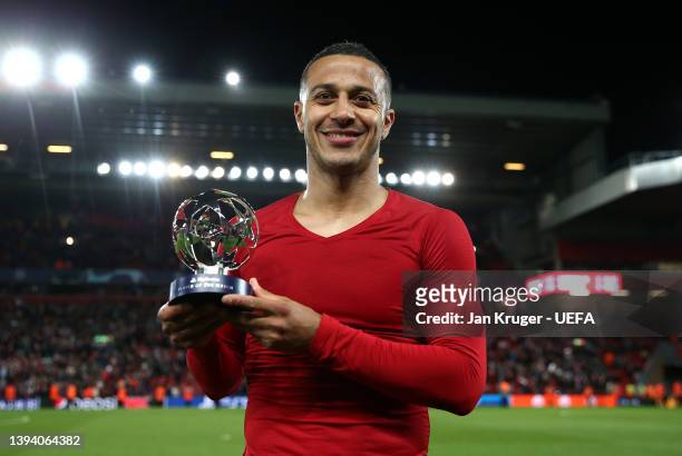 Thiago Alcantara of Liverpool poses for a photo with their Playstation player of the match award after the UEFA Champions League Semi Final Leg One...