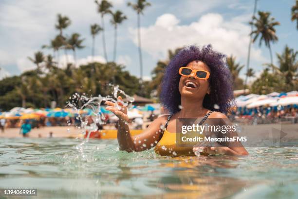 woman having fun at porto de galinhas beach - dyed shades stock pictures, royalty-free photos & images