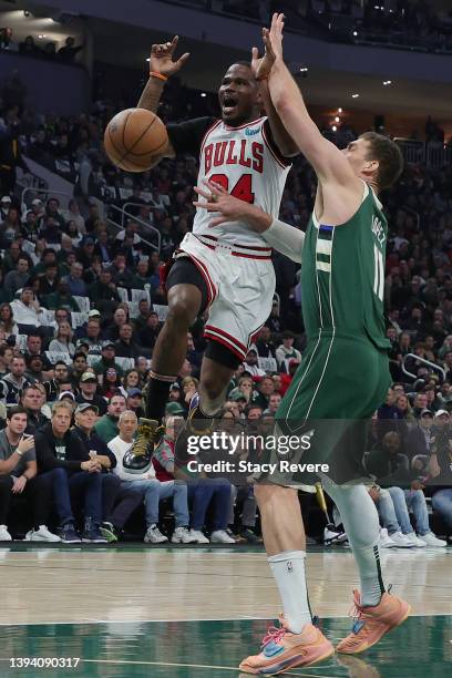 Javonte Green of the Chicago Bulls is defended by Brook Lopez of the Milwaukee Bucks in the first quarter during Game Five of the Eastern Conference...