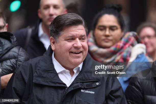 Illinois Gov. J.B. Pritzker listens to speakers during a transgender support rally at Federal Building Plaza on April 27, 2022 in Chicago, Illinois....