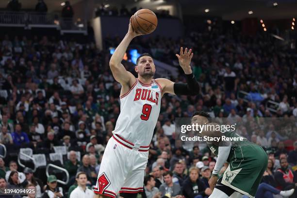 Nikola Vucevic of the Chicago Bulls drives around Giannis Antetokounmpo of the Milwaukee Bucks in the second quarter during Game Five of the Eastern...