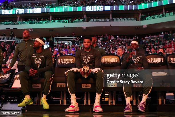 Wesley Matthews, Giannis Antetokounmpo and Jrue Holiday of the Milwaukee Bucks wait for player introductions prior to Game Five of the Eastern...