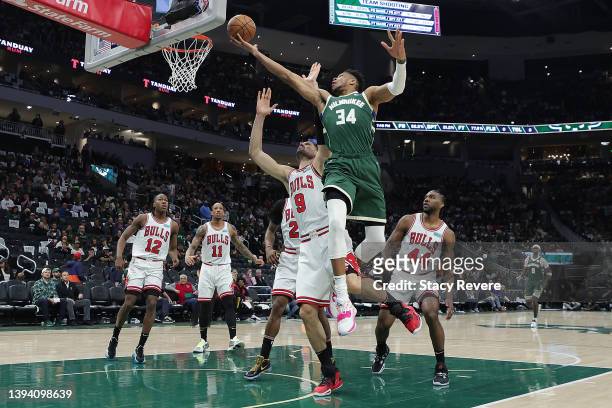 Giannis Antetokounmpo of the Milwaukee Bucks drives to the basket against Nikola Vucevic of the Chicago Bulls in the third quarter during Game Five...