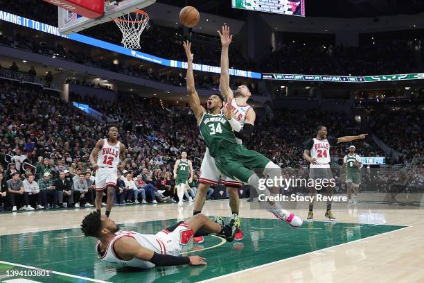 Giannis Antetokounmpo of the Milwaukee Bucks is fouled by Troy Brown Jr. #7 of the Chicago Bulls during the second half of Game Five of the Eastern...