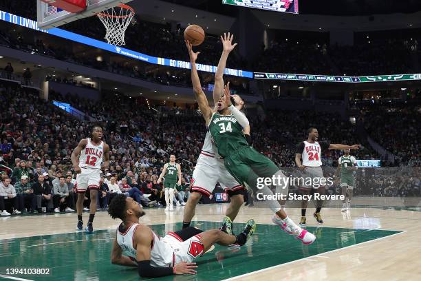 Giannis Antetokounmpo of the Milwaukee Bucks is fouled by Troy Brown Jr. #7 of the Chicago Bulls during the second half of Game Five of the Eastern...