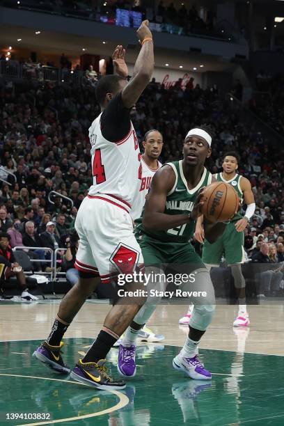 Jrue Holiday of the Milwaukee Bucks is defended by Patrick Williams of the Chicago Bulls during the second half of Game Five of the Eastern...