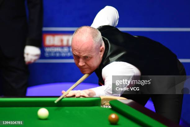 John Higgins of Scotland plays a shot during the quarter-final match against Jack Lisowski of England on day 12 of the Betfred World Snooker...