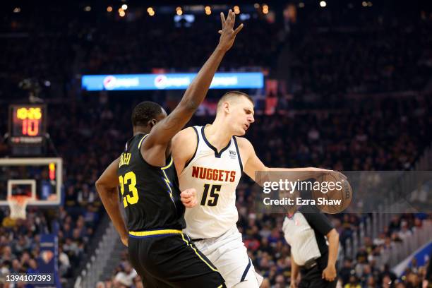 Draymond Green of the Golden State Warriors guards Nikola Jokic of the Denver Nuggets during the first half of Game Five of the Western Conference...
