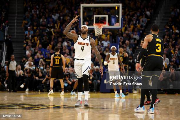 DeMarcus Cousins of the Denver Nuggets reacts after he made a three-point basket against the Golden State Warriors at the end of the third quarter...