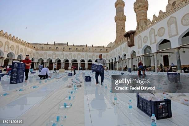 Mosque staff organize food before breaking fast during the month of Ramadan inside the Al-Azhar Mosque on April 27, 2022 in Cairo, Egypt.