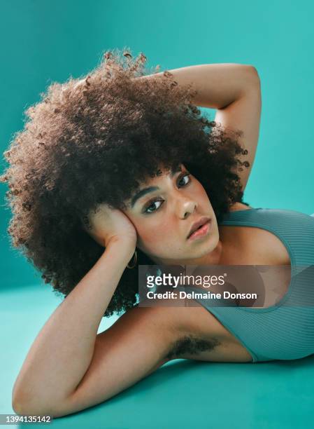 mixed race woman lying and posing in the studio - armpit hair 個照片及圖片檔