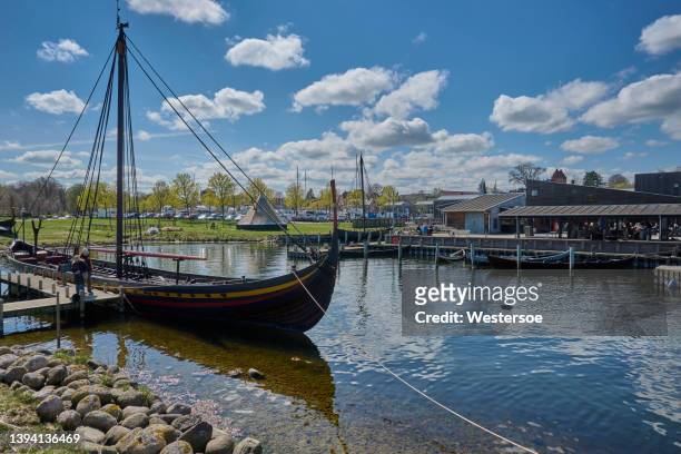 viking ships in roskilde harbor from the nearby museum - roskilde fjord stock pictures, royalty-free photos & images
