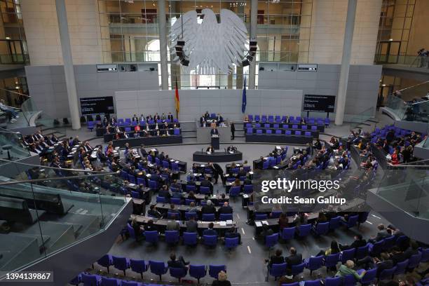 Friedrich Merz, head of the opposition German Christian Democrats , speaks during debates and prior to a vote on a new set of measures for supporting...