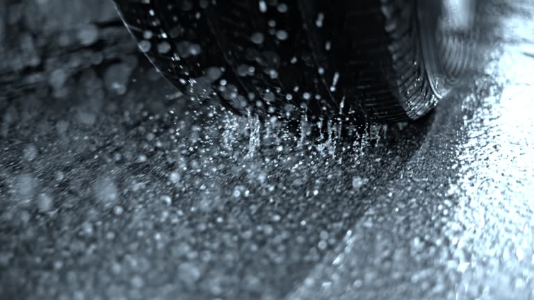 https://media.gettyimages.com/id/1394154520/video/tire-of-a-car-driving-on-an-asphalt-road-in-rain.jpg?b=1&s=640x640&k=20&c=uFnxxzbs4Dg9RzGMbjs_MwQohH9fRqHZy9QADAutDX4=
