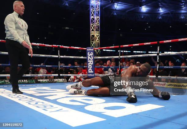 Dillian Whyte reacts to being knocked out by Tyson Fury during the WBC World Heavyweight Title Fight between Tyson Fury and Dillian Whyte at Wembley...