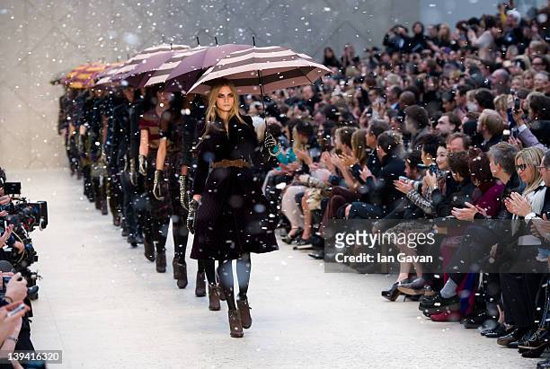 Cara Delevingne and models walk the runway during the Burberry Prorsum show at London Fashion Week Autumn/Winter 2012 at Kensington Gardens on...