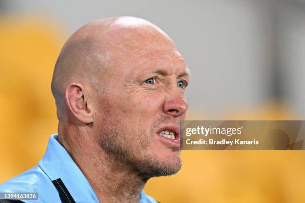 Sharks coach Craig Fitzgibbon watches his players warm up during the round eight NRL match between the Brisbane Broncos and the Cronulla Sharks at...