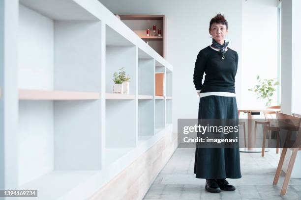 business woman in office - only mature women stock pictures, royalty-free photos & images