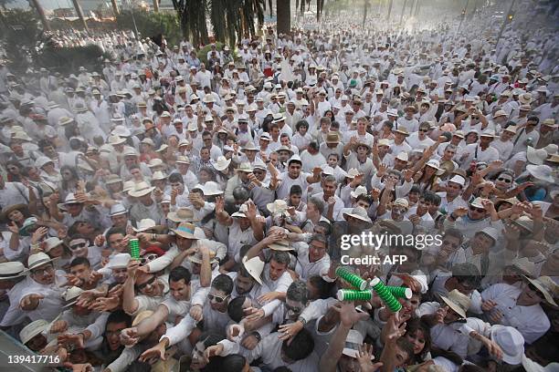 People throw talcum powder at one another as they take part in the carnival "Los Indianos" in Santa Cruz de la Palma, on the Spanish Canary island of...