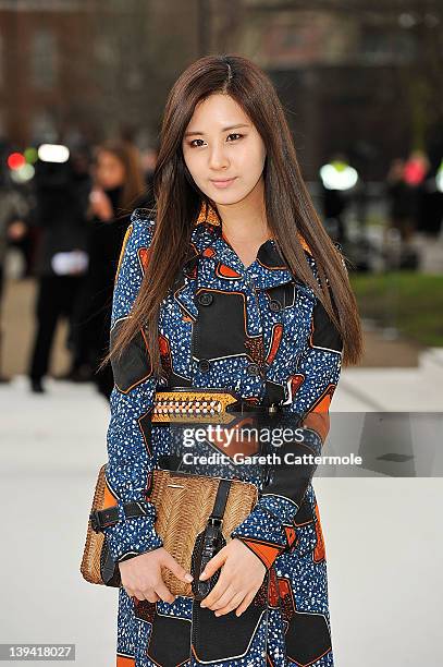 Singer Seohyun from girl band 'Girls Generation' arrives at the Burberry Autumn Winter 2012 Womenswear show at London Fashion Week Autumn/Winter 2012...