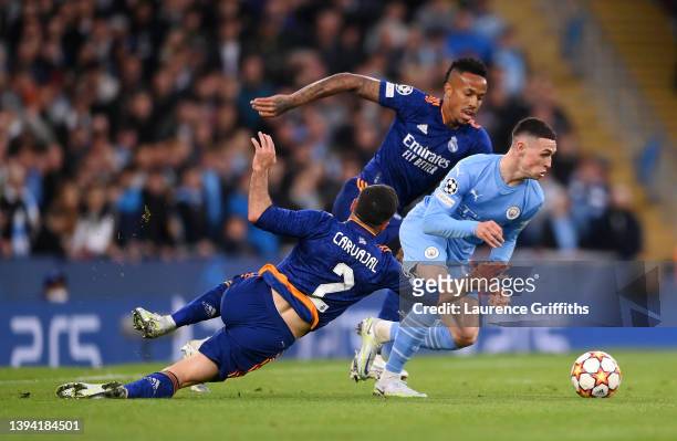 Phil Foden of Manchester City gets away from Daniel Carvajal and Eder Militao of Real Madrid during during the UEFA Champions League Semi Final Leg...